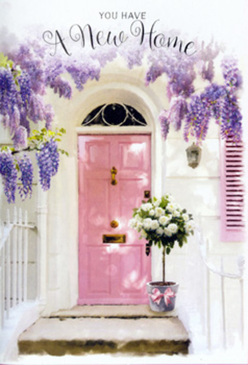 This image captures the front step of a new home in Surrey Quays, bathed in soft daylight and wrapped in pastel charm. At its heart stands a whimsically painted pink door, its warm colour glowing gently against a backdrop of whitewashed walls and a single pale shutter, as if echoing the relaxed charm of streets leading down to Southwark Park and the docks. Above and along the frame, wisteria cascades freely, with clusters of lavender and lilac blossoms tumbling in loose curtains that suggest both fragrance and movement. Each trailing stem casts a lacy shadow over the doorway, giving the entrance a dreamy, almost storybook quality. On the doorstep, a stylish grey metal bucket has been arranged with a florist's careful eye: full, rounded white and cream roses nestle closely together, their ruffled petals opening into soft blooms, interlaced with delicate green foliage that spills just over the rim. A narrow pink ribbon circles the bucket and ties into a relaxed bow, repeating the door's blush tones and bringing a sense of cohesion to the scene. Light filters across the steps in dappled patches, as though it has slipped through the trailing wisteria to rest on the flowers. The mood is calm yet filled with anticipation, like the evening before a housewarming gathering. Every element-the pastel palette, the gentle textures, the considered placement of the bouquet-suggests a gift crafted to celebrate moving in, a welcoming floral touch that a local Surrey Quays florist might deliver for a couple starting their life together in a new riverside home.