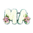 This image shows a dignified floral letter tribute spelling out MA, created as a loving farewell for a mother, grandmother, or cherished Mama from a family in the Surrey Quays area. The arrangement sits against a clean white background, allowing the craftsmanship and colour harmony to take full focus. Each capital letter is padded with a thick covering of white chrysanthemums, their tight, domed heads forming a lush cushion with a soft, almost velour-like texture. The petals catch subtle highlights, giving the impression of gentle light falling across the tribute, much like the soft brightness that filters through the trees around Surrey Quays Park. Around the outer edge of both the M and the A, a dark green trim-either gathered ribbon or precisely arranged foliage-creates a smooth, continuous border. This green edge frames the snowy chrysanthemums and lends a composed, finished look, ensuring the letters are instantly readable even from a distance. At the lower left base of the M and the lower right of the A, complementary mini-posies introduce a touch of colour and sentiment. Pale pink roses and softly shaded lilac roses combine with petite pink spray roses, their petals gently spiralled and slightly open, suggesting tenderness and remembrance. Slender fern fronds and small sprigs of greenery complete these clusters, adding natural movement and texture. The design feels intimate yet composed, suitable for resting alongside a coffin, near the lectern at a crematorium chapel, or on a memory table at a wake. Its restrained palette and elegant form allow it to convey deep affection and respect without overpowering the quiet atmosphere of a farewell ceremony.